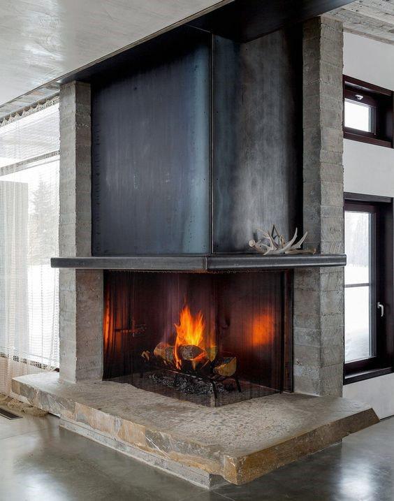 Steel and concrete corner fireplace design